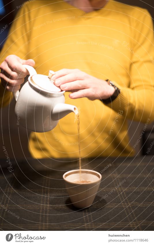 serve the tea Beverage Tea Black tea Pot Mug Tea cup Teapot Joy Man Adults Hand Fingers 1 Human being Table To hold on Elegant Friendliness Brown Yellow Gold