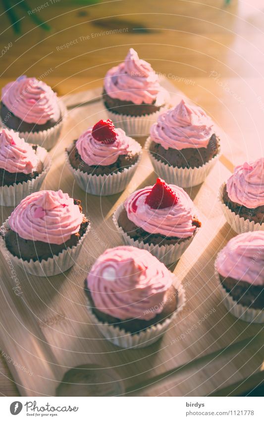 Raspberry - Cupcakes Dough Baked goods Cake Dessert Candy Tray Wood Esthetic Fragrance Delicious Positive Sweet Yellow Pink To enjoy Passion Cream Colour photo