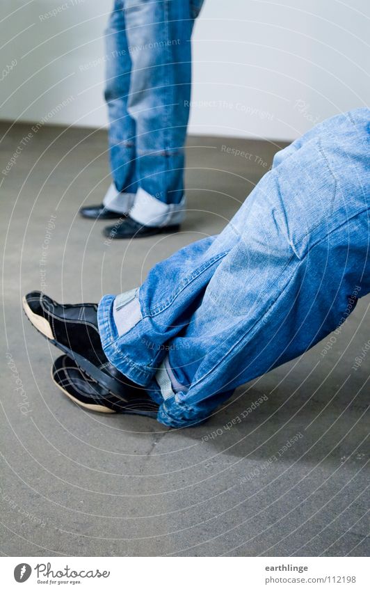 double denim Concrete Stand Outstretched Footwear Relaxation Uniqueness Washed out Pants Gray Landscape format Colour photo Working man Foreground