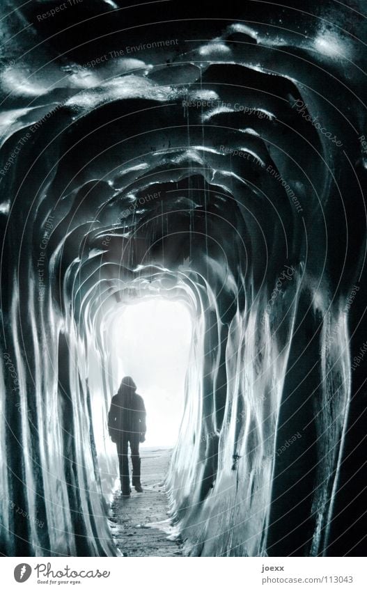 Tunnel into the light Nightmare Way out Narrow Dark Entrance Loneliness Iceberg Blue Cold Frozen water Fluid Damp Freeze Glacier Glacier ice Creepy Cave Jacket