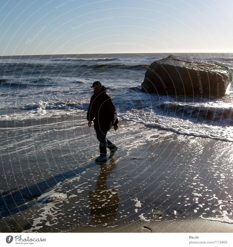 Papa on tour Vacation & Travel Reflection White Dark Beach Coast Waves Foam Wet Man To go for a walk Hiking Summer North Sea Rock Beautiful weather Denmark