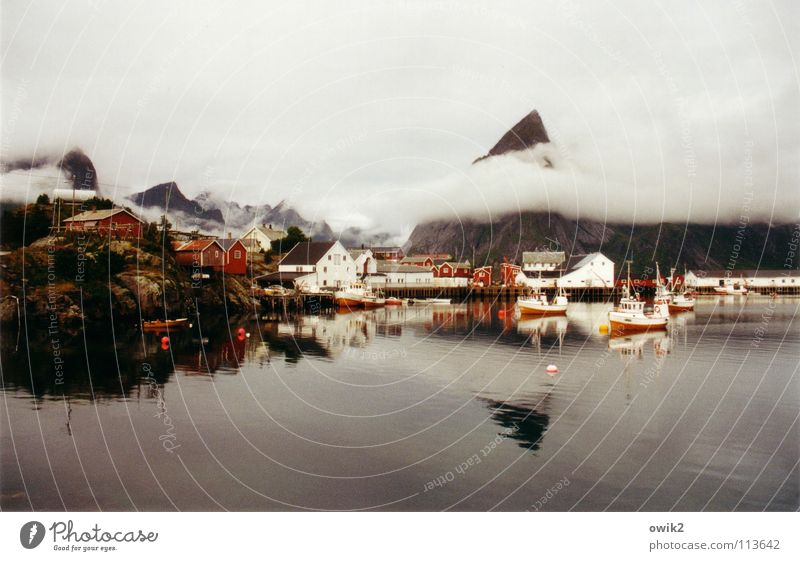 Covered Far-off places Ocean Island Mountain Water Clouds Weather Bad weather Fishing village Harbour Navigation Fishing boat Watercraft Fresh Cold Above Point