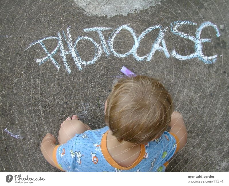 Photocase with artist Characters Letters (alphabet) White Concrete Gray Logo Hand Reading Under Child T-shirt Blonde photocase Chalk Stone