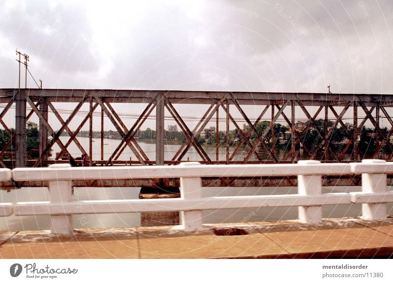 new & old [two bridges] Far-off places Badlands Grass Edge Going Horizon Clouds Brown Gray White Wood Steel Iron Grating Footbridge Brook Body of water Bridge