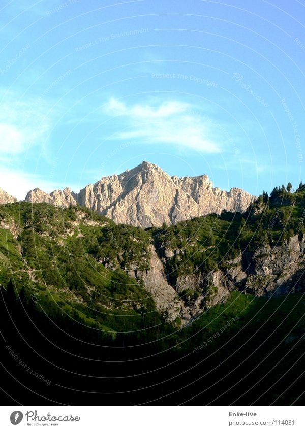 A little mountain in the landscape Clouds Forest Meadow Green Black Panorama (View) Summer Transport Sky Blue Mountain massif Alps Valley Shadow