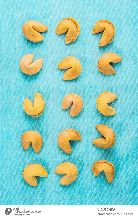 Fortune cookies on blue background Dessert Nutrition Style Design Restaurant Joy Self-confident Optimism Curiosity Hope Disappointment Fear of the future