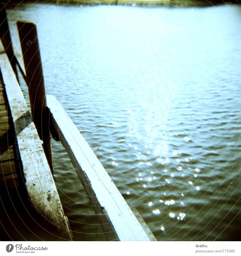 Relax your soul Steinhuder Lake Sunbeam Waves Footbridge Wood Summer Jetty Watercraft Ocean Holga Medium format Good mood Relaxation Leisure and hobbies