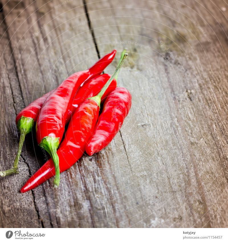 chili Chili Husk Wood Wooden board Tangy Spicy Herbs and spices Near Close-up Red entirely Heap Kitchen Vegetable Pepper Healthy Eating Dish Food photograph