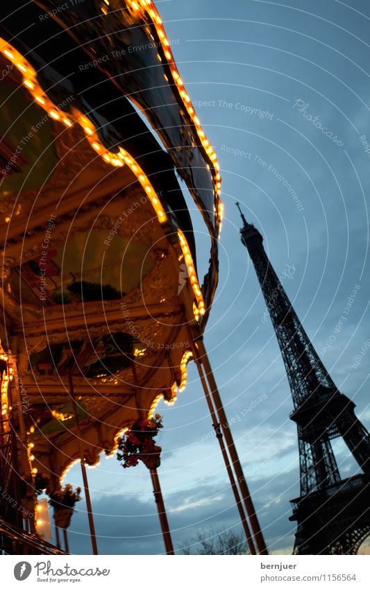 merry-go-round Town Capital city Tourist Attraction Monument Eiffel Tower Rotate Famousness Blue Gold Contentment Carousel Light Movement Paris Clouds Sky