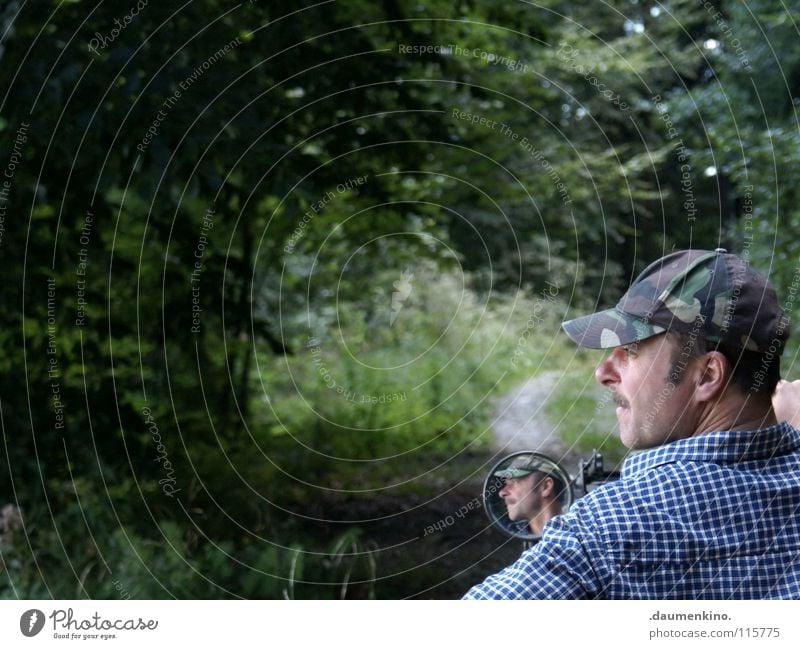 on the road again Man Baseball cap Camouflage Mirror Rear view mirror Shirt Tree Mirror image Sentimental Past Future Hand Fingers Vessel Meadow Grass Driving