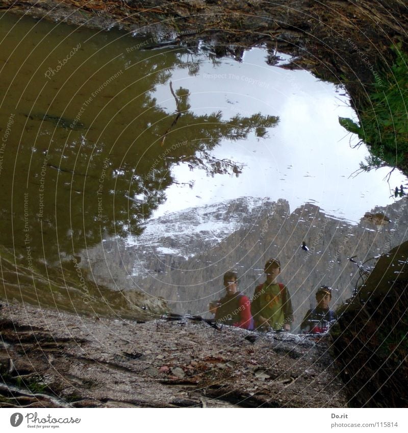 Goonies Puddle Mirror Grass Gray Mud Dolomites Peak Child Mirror image Clouds Dark Planning Coniferous trees Italy Tunnel Water Mountain Rock Sky Val Gardena