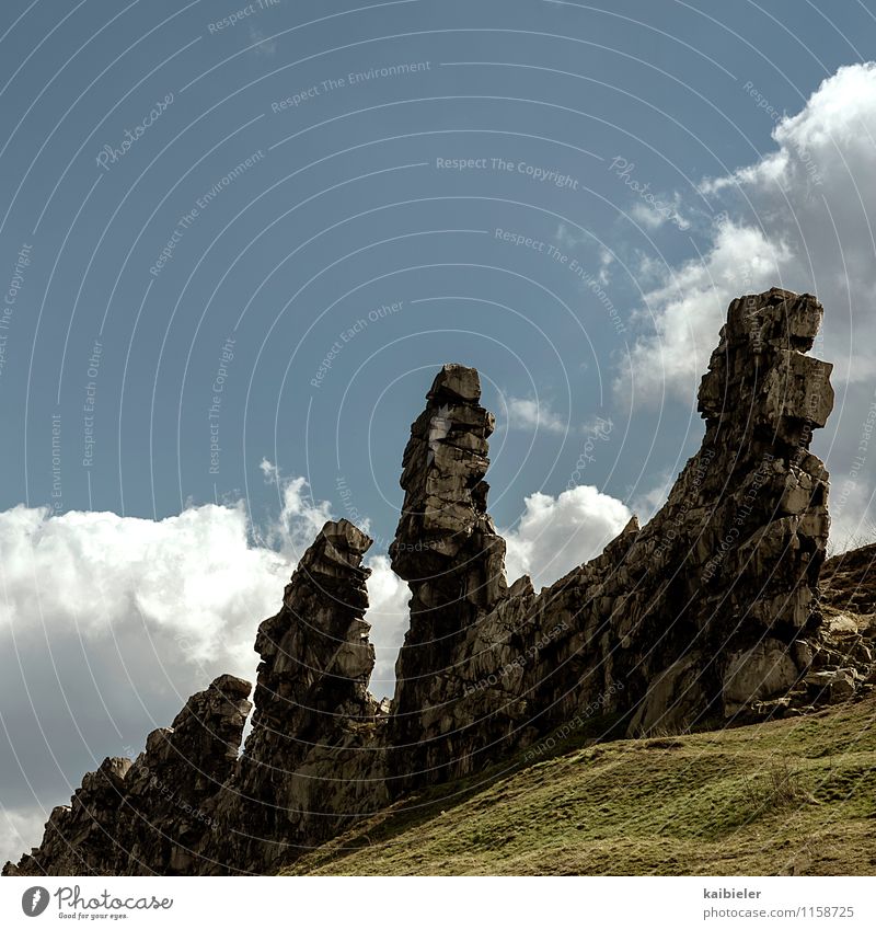 Trinity Vacation & Travel Tourism Trip Mountain Nature Landscape Sky Clouds Spring Beautiful weather Grass Rock Old Threat Sharp-edged Blue Yellow Teufelsmauer