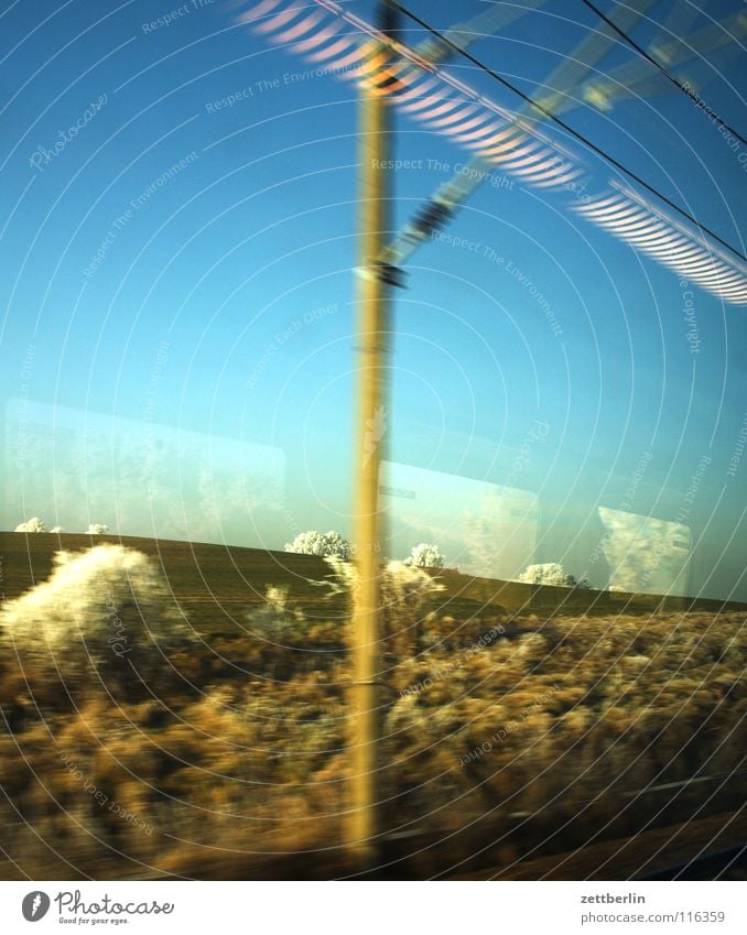 Rail journey to the north 4 Tree Bushes Winter Hoar frost Immature Railroad Train window Overhead line Light Lamp Reflection Driving Passage Landscape Sky