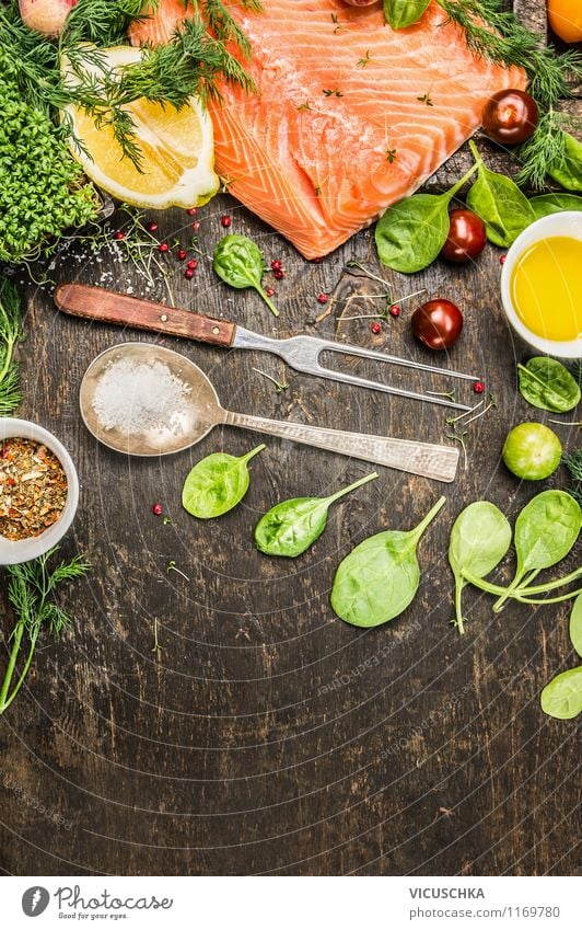 Salmon fillet with ingredients on a rustic wooden table Food Fish Vegetable Lettuce Salad Herbs and spices Cooking oil Nutrition Lunch Dinner Buffet Brunch