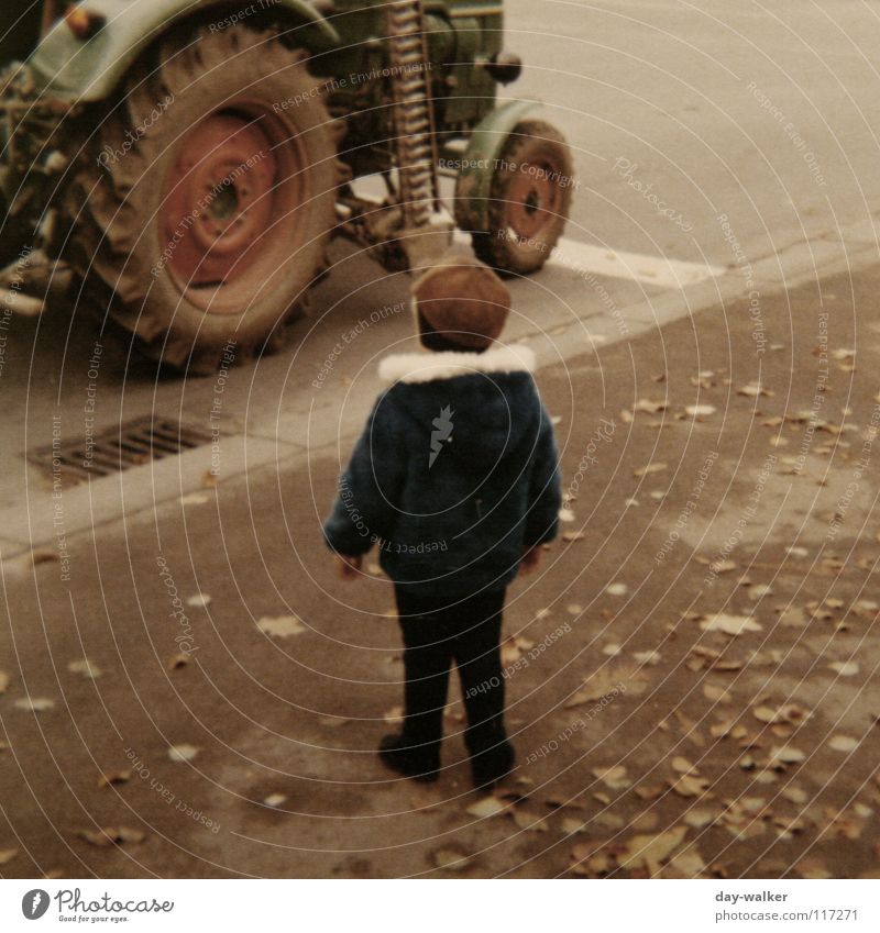 Man and Technology Child Boy (child) Tractor Seventies Machinery Asphalt Leaf Sidewalk Retro Amazed Driving Stand Old Street Wheel Marvel Respect me Walking