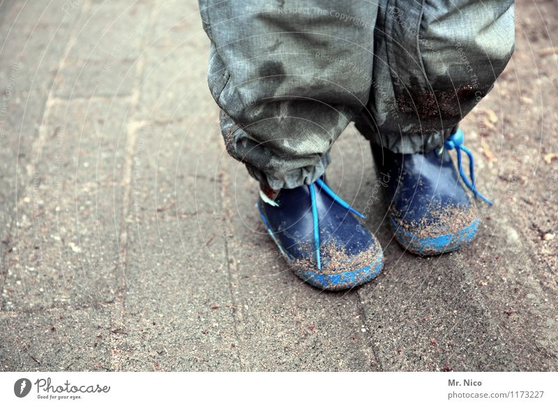 bad weather outfit Lifestyle Leisure and hobbies Child Infancy Legs Feet Bad weather Rubber boots Stand Dirty Blue Gray Rain pants Watertight