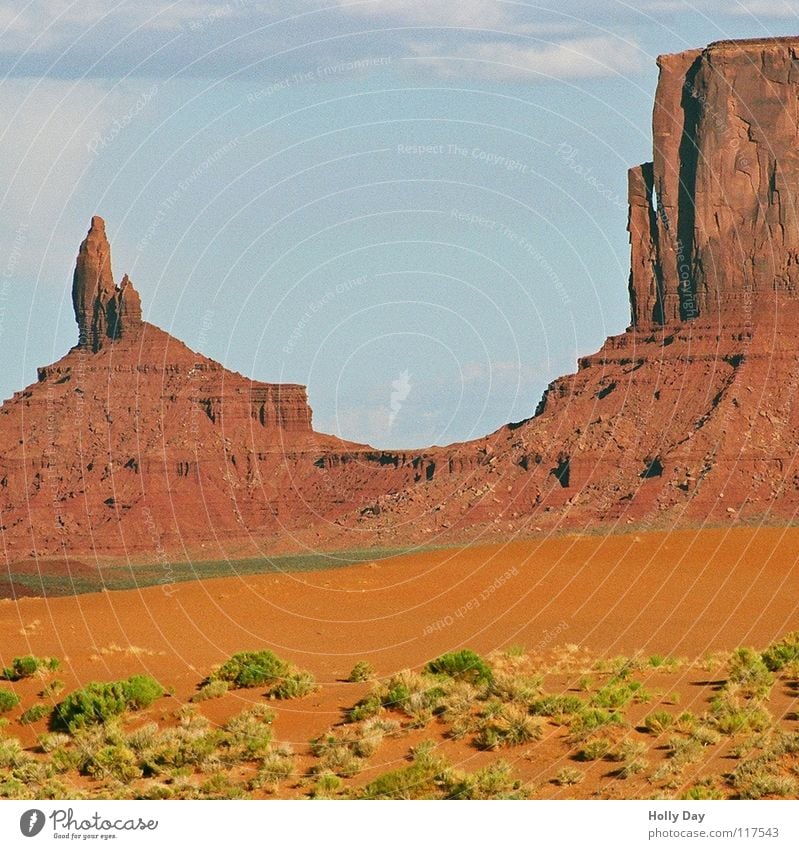 monumental Red Green Tuft of grass Utah Arizona Summer Clouds Multicoloured Desert USA Monument Valley Colour Orange Rock Mountain rock needle Vest