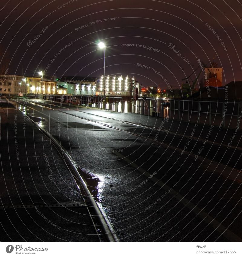 Night light Long exposure Calm Loneliness Railroad tracks Asphalt Light Reflection Puddle Jetty Harbour Industry Lamp Water Basin Coast