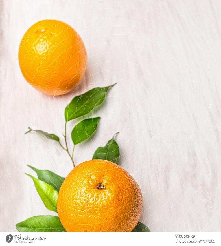 Fresh oranges on twig with leaves Food Fruit Orange Nutrition Breakfast Organic produce Vegetarian diet Diet Juice Style Design Healthy Eating Life Summer