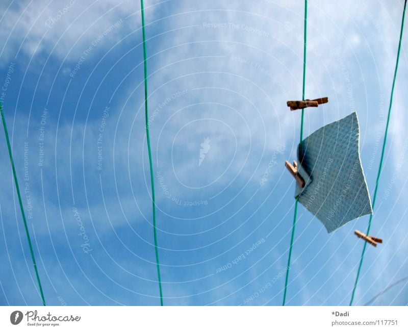 winter sky Clothesline Green Empty Across Parallel Beaded White Clouds Absorbent cotton Soft Wood Small Scaredy-cat Frozen Cold Motionless Dirty Brown Brownish