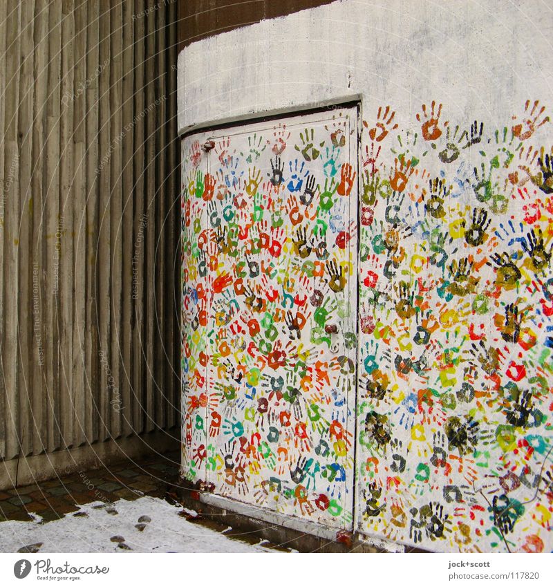 Design wall with many colourful hands Hand Snow door Decoration Many Environment Participation Difference Corner Imprint Teamwork Street art Multicoloured