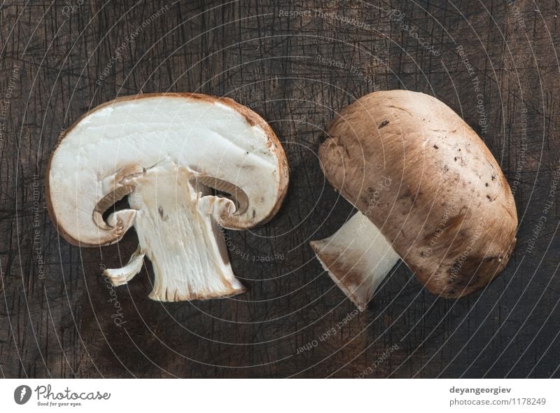 Sliced mushrooms on wooden table Vegetable Nutrition Dinner Vegetarian diet Diet Table Cook Nature Fresh Delicious Natural Brown White Mushroom food healthy