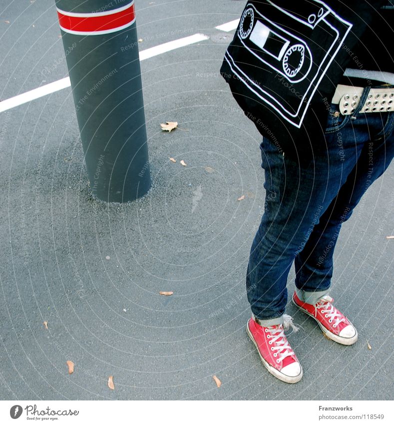 Sound carrier. Asphalt Chucks Column Leaf Belt Tape cassette Bag Transport Sneakers Generation Autumn Leipzig Graphic Traffic infrastructure Street Jeans Legs