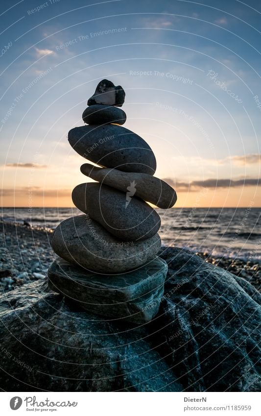 stone on stone Nature Landscape Sky Clouds Weather Beautiful weather Coast Baltic Sea Blue Orange Black Tower Cairn Horizon Water Waves Colour photo