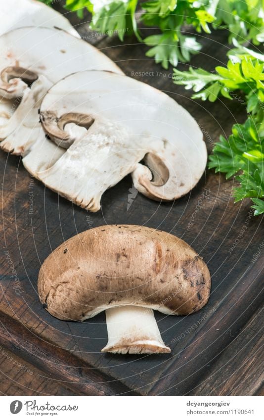 Sliced mushrooms on wooden table Vegetable Nutrition Dinner Vegetarian diet Diet Table Cook Nature Fresh Delicious Natural Brown White Mushroom food healthy