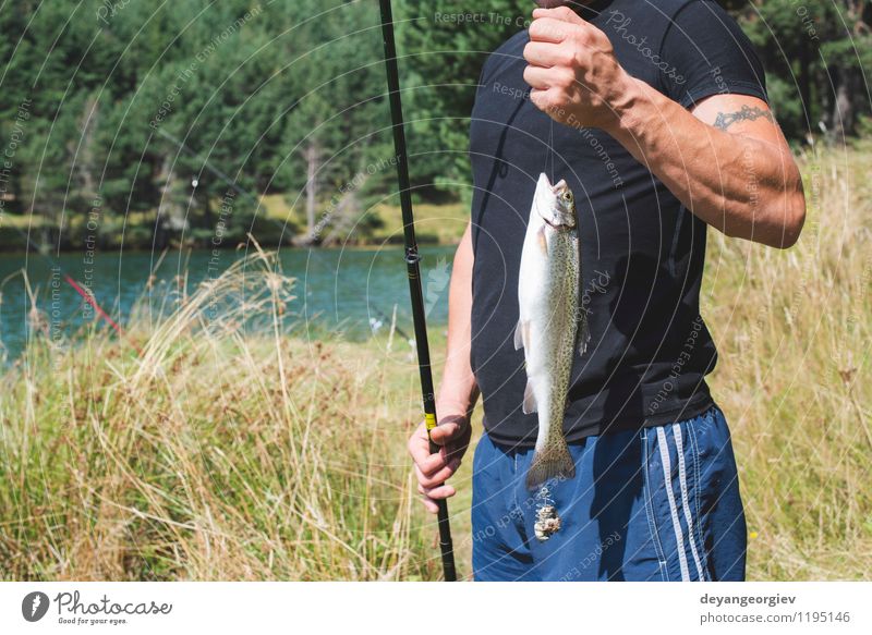 Fisherman caught a fish Happy Relaxation Leisure and hobbies Fishing (Angle) Vacation & Travel Summer Sports Human being Man Adults Nature Lake River Success