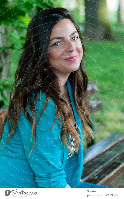 A young woman sitting on a garden bench Lifestyle Vacation & Travel Human being Young woman Youth (Young adults) Head 1 18 - 30 years Adults Environment Summer