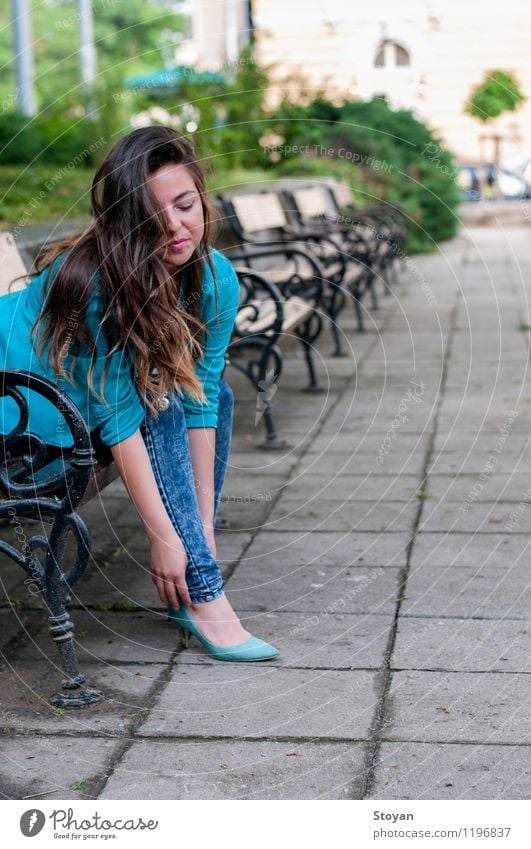 A young woman sitting on a garden bench Lifestyle Luxury Elegant Style Design Beautiful Young woman Youth (Young adults) 1 Human being 18 - 30 years Adults