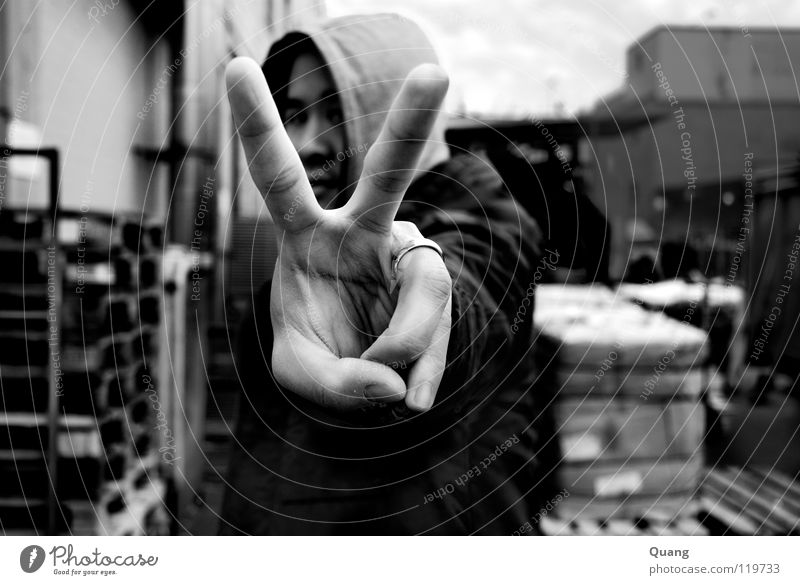 angle view Peace Matrimony Hooded (clothing) Hand Fingers Wedding band Exterior shot Black & white photo Man Corner Circle Freedom