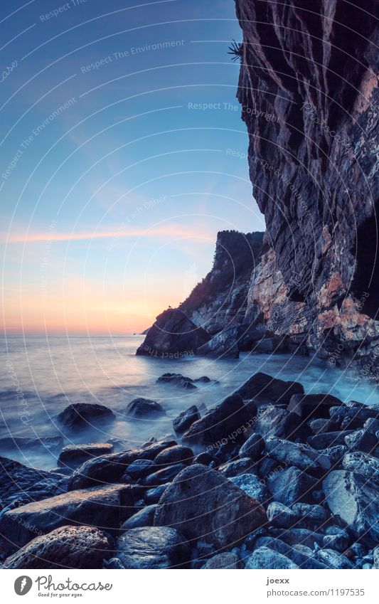 Quarry Nature Sky Clouds Horizon Sunrise Sunset Beautiful weather Coast Ocean Gigantic Large Tall Blue Brown Orange Black White Calm Colour photo Multicoloured