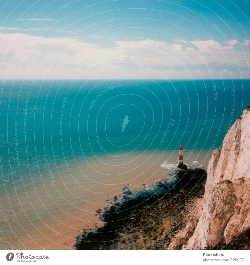 Make ma´n photo treasure! Lighthouse England Coast Ocean Waves Clouds Horizon Red White Lake White crest Surf Vantage point Loneliness Day Summer