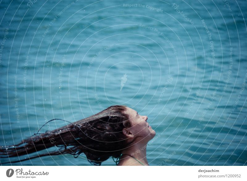 A girl is standing in the water and throws her wet hair backwards with verve. Style Joy Hair and hairstyles Life Swimming & Bathing Trip Ocean Aquatics