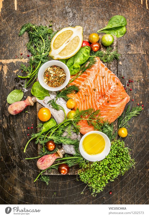 Salmon fillet with fresh herbs, lemon and tomatoes Food Fish Lettuce Salad Herbs and spices Cooking oil Nutrition Lunch Dinner Banquet Organic produce