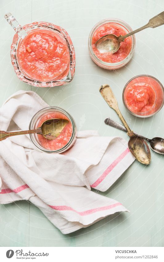 Rhubarb compote, freshly made. Food Fruit Dessert Nutrition Breakfast Organic produce Vegetarian diet Diet Cup Glass Spoon Summer Cool (slang) Pink Design Style