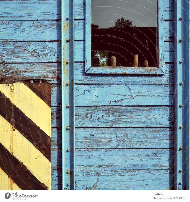 WINDOW BOARD Window Transport Logistics Train travel Rail transport Railroad Old Wait Blue Yellow Black construction wagon Wooden wall Colour photo