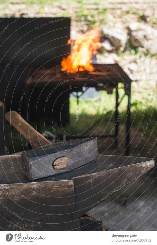 Vise and anvil in a forge shop. Work and employment Craft (trade) Tool Hammer Metal Steel Old Dirty Hot Retro Red Tradition Anvil fire Blacksmith tools iron