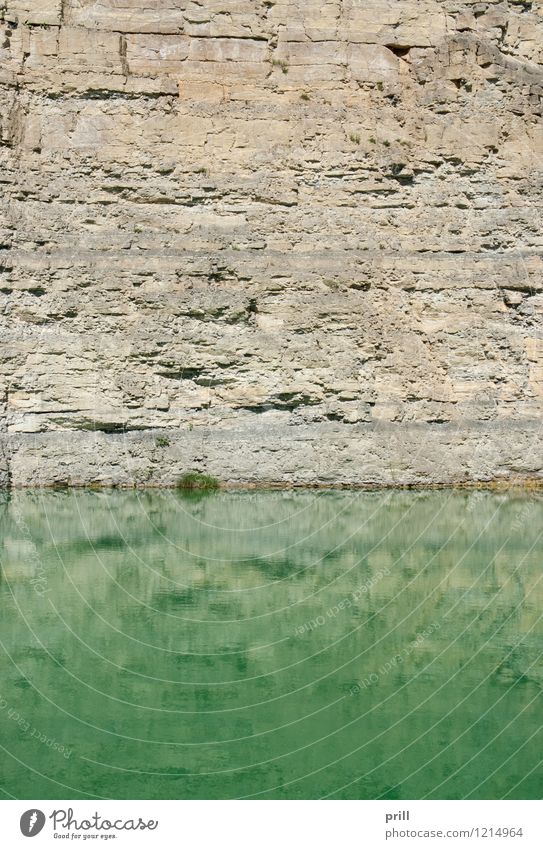 lake at a gravel quarry Nature Water Rock Pond Lake Stone Glittering Green Quarry Pit open quarry Rock formation Wall of rock sunny Excavation Germany