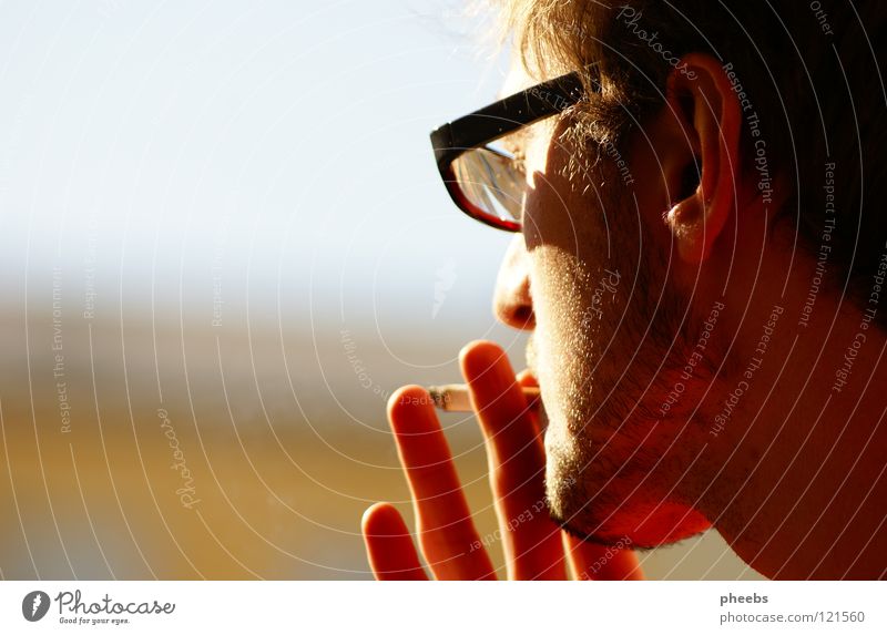 above on the skyscraper Man Cigarette House (Residential Structure) High-rise Bright Yellow Eyeglasses Silhouette Hand Fingers Smoking Youth (Young adults)