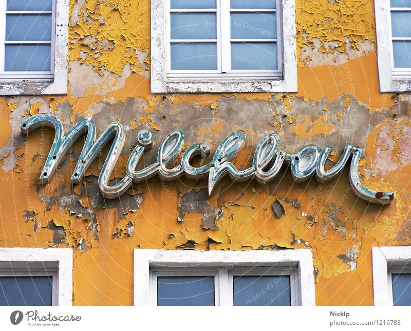 old decayed neon sign of the Milchbar in Stralsund, Germany Milk bar Neon sign Typography Characters Signs and labeling Old Decline Past Yellow-orange White