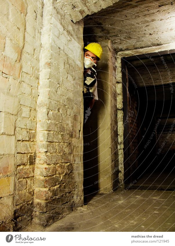 urban warfare Work and employment Construction worker Helmet Construction site helmet Yellow Warning colour Face mask Breath Gloves Drill Cellar Dark