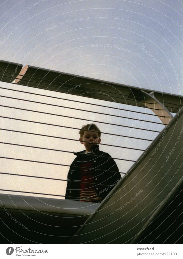 white boy Think Grief Child Ambiguous Orientation Future Exterior shot Back-light Dusk Distress Bridge Contentment Boy (child) Sadness Sky Blue