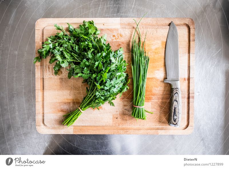 It's served Food Herbs and spices Organic produce Crockery Knives Brown Green Silver Chives Parsley Blade Chopping board Wooden board Steel Kitchen equipment