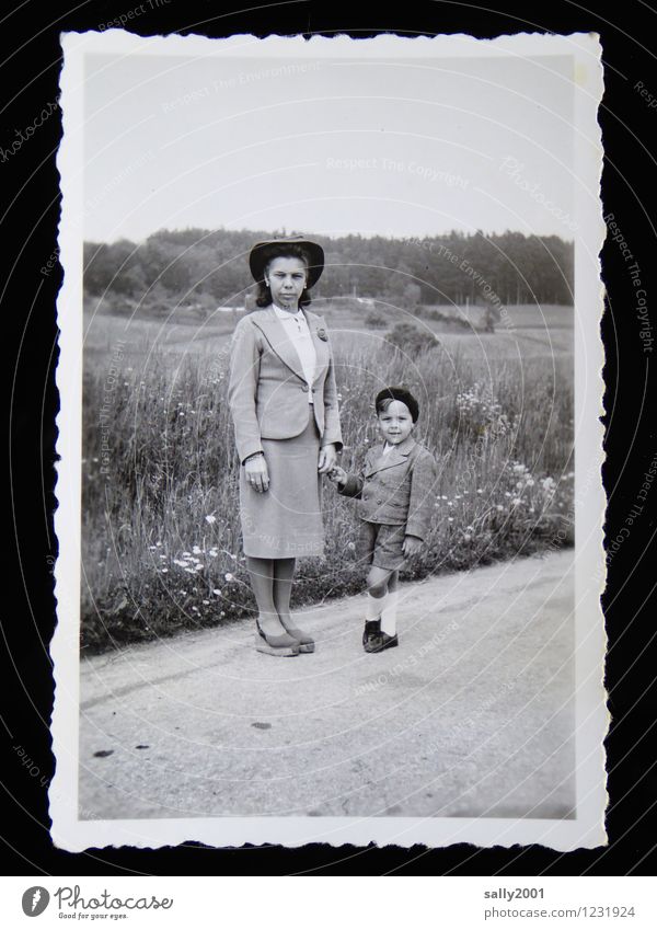 Childhood recollection of Sunday walk... Boy (child) Woman Adults Mother 2 Human being Meadow Field Street Lanes & trails Suit Carnival costume Sock