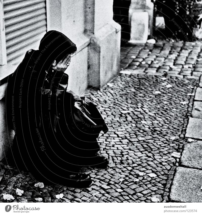 Sad: Man Coat House (Residential Structure) Wall (building) Black Leather Grief Fear Sidewalk Cobblestones Crouch Hand Concealed Mysterious Analog Distress