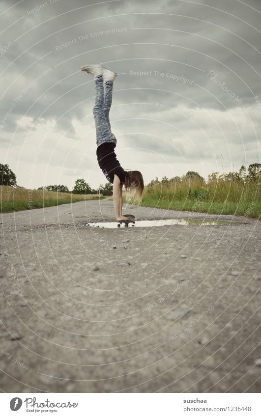 the handstand ... Lanes & trails Asphalt Exterior shot Footpath Puddle Wet Child Girl Handstand Athletic Skateboarding Stunt Dangerous Brave Infancy Freedom