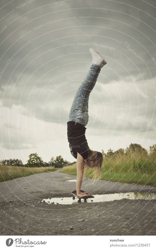 the handstand .. Lanes & trails Asphalt Exterior shot Footpath Puddle Wet Child Girl Handstand Athletic Skateboarding Stunt Dangerous Brave Infancy Freedom